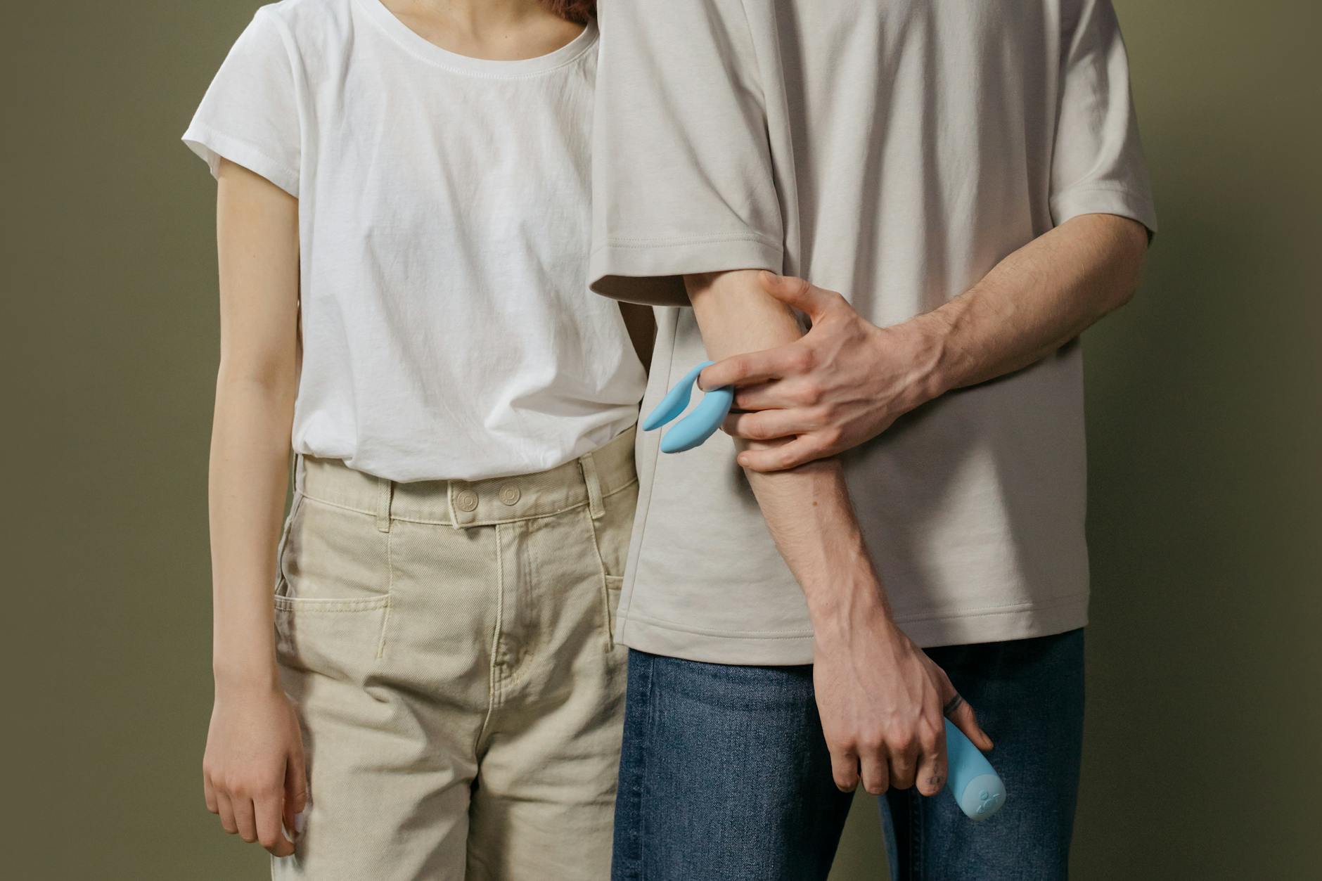 A couple standing together indoors, demonstrating how partners can approach intimate conversations about toys